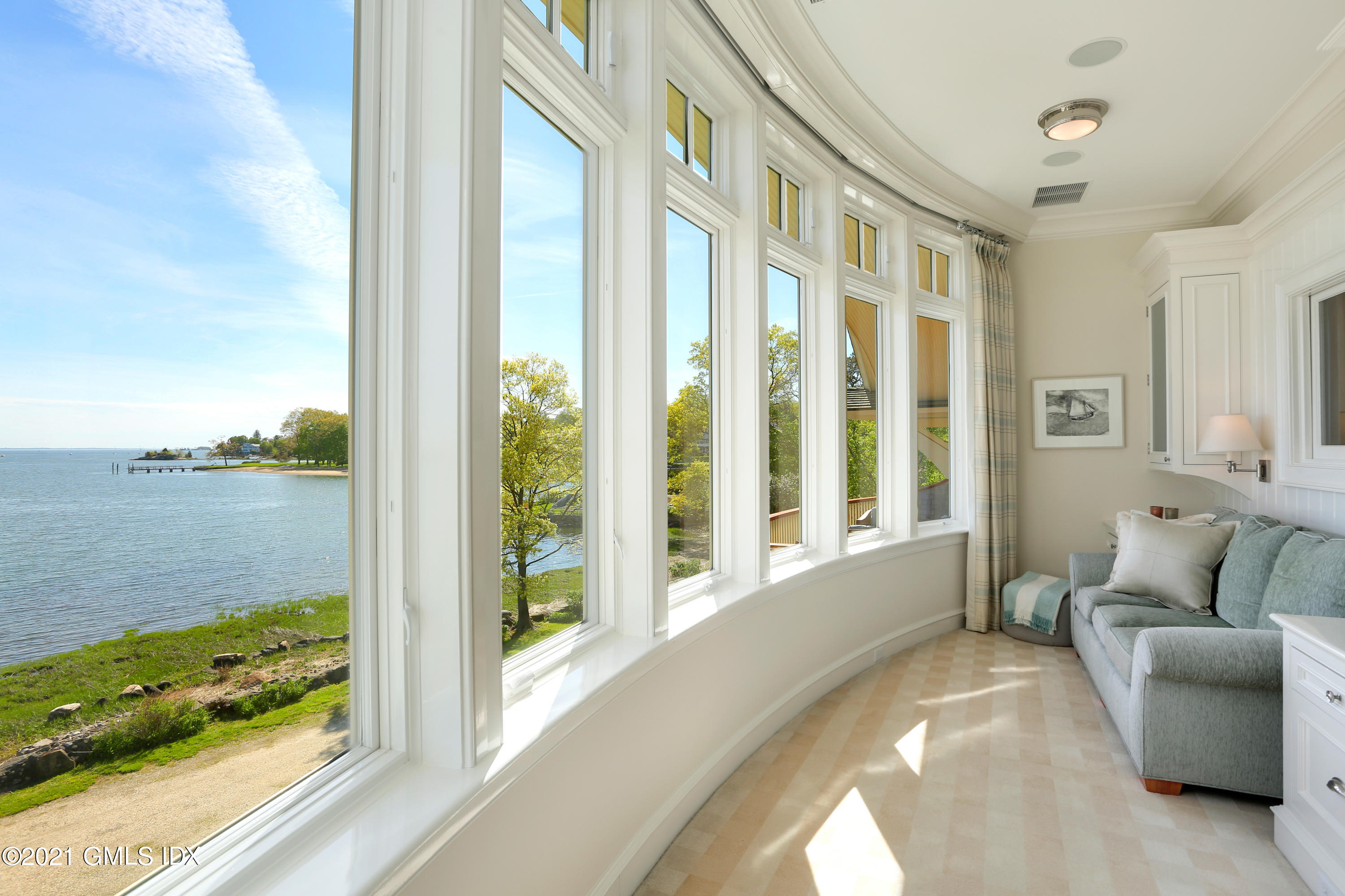 51 Willowmere Circle Riverside, CT 06878 - Photo 25 of 42 a living room with furniture and floor to ceiling windows