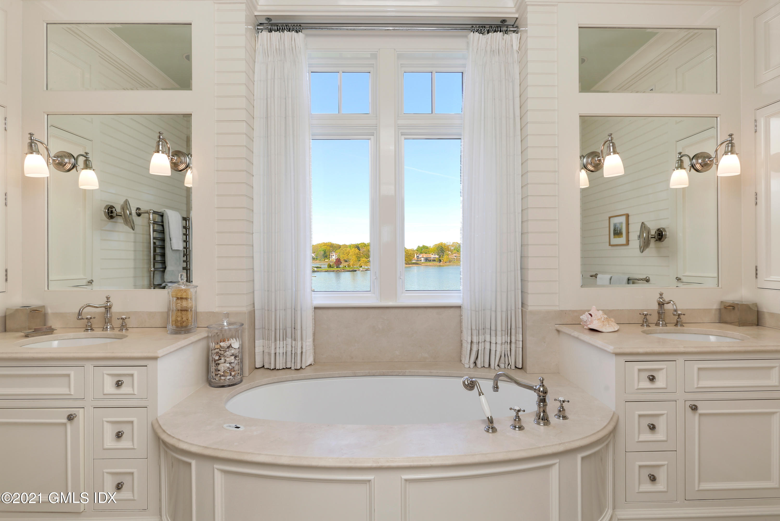 51 Willowmere Circle Riverside, CT 06878 - Photo 27 of 42 a bathroom with a sink and a mirror