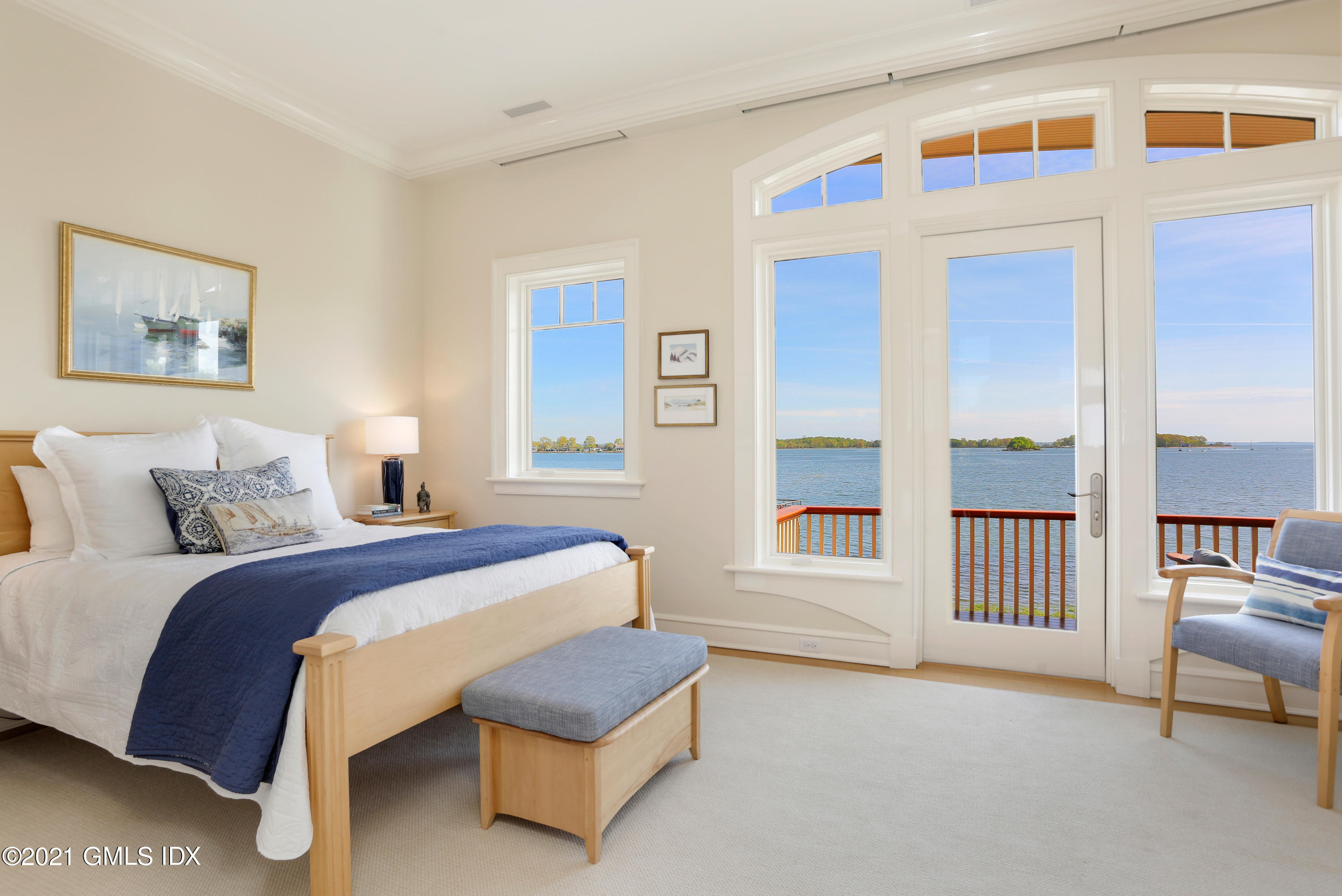 51 Willowmere Circle Riverside, CT 06878 - Photo 29 of 42 a spacious bedroom with a bed and a large window