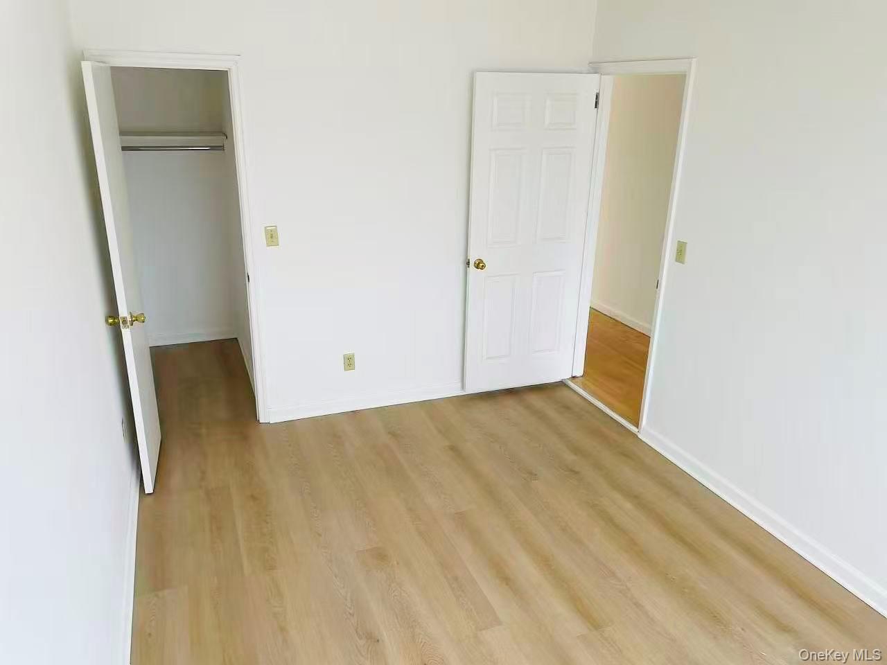 100-05 37th Avenue, Unit 4 Queens, NY 11368 - Photo 5 of 10 Unfurnished bedroom with light wood-style floors