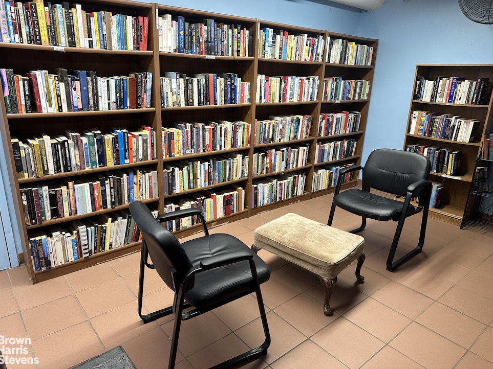 140 West End Avenue, Unit 11B Manhattan, NY 10023 - Photo 12 of 18 a view of a workspace with bookshelf and a workspace
