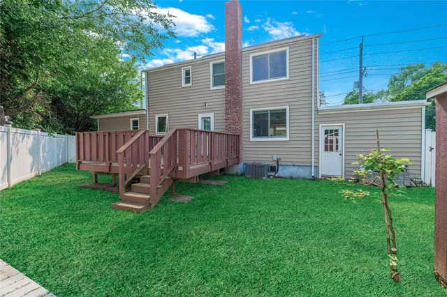 a view of a backyard with plants and a garden
