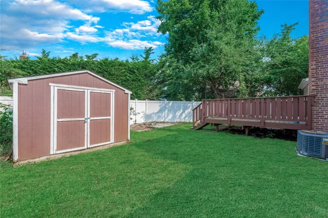 a view of a wooden fence