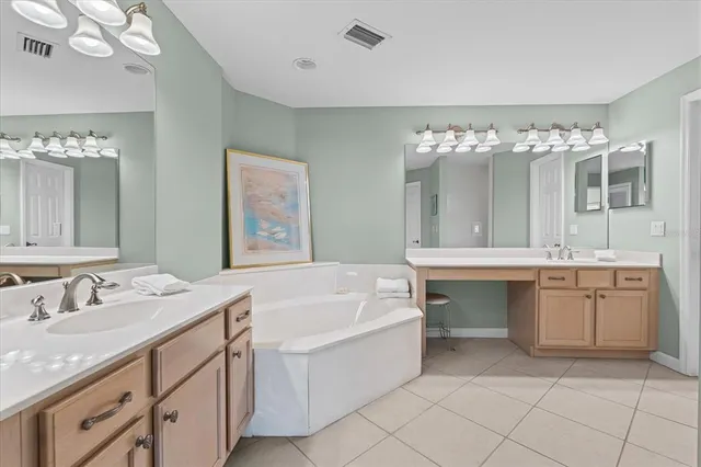 a bath room with a sink and a mirror