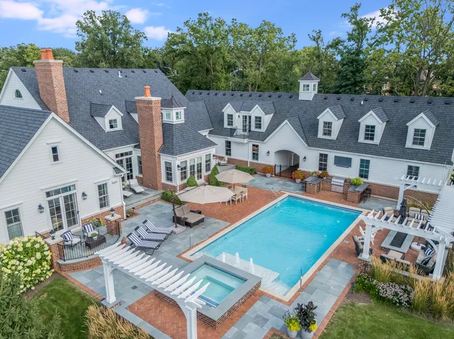 a living room with fireplace furniture and a large window