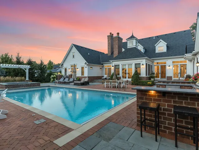 a living room with furniture a flat screen tv and a floor to ceiling window