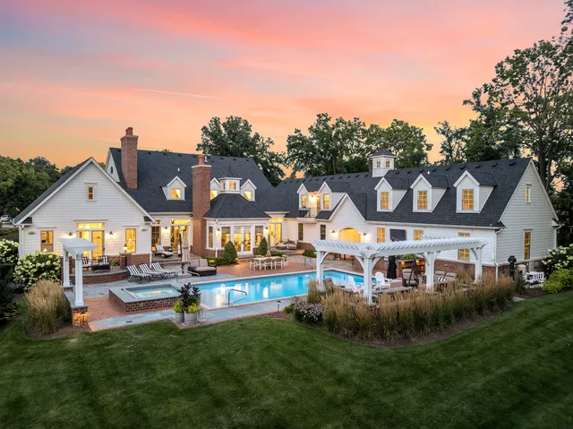 a view of a house with outdoor space and sitting area