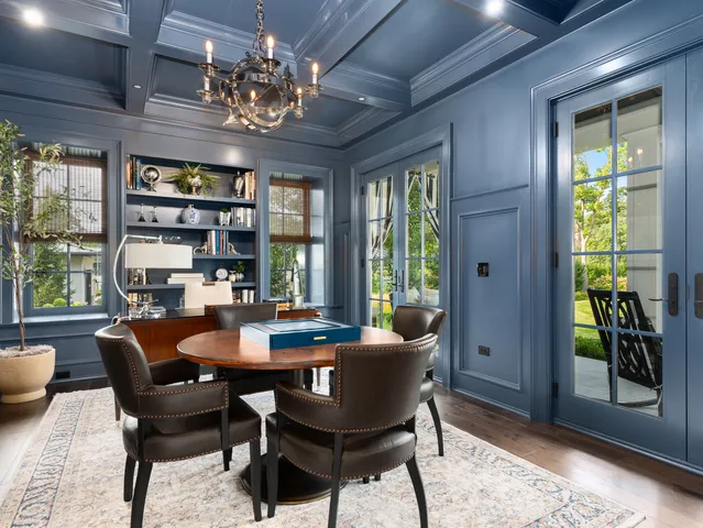 a bedroom with bed couch and window