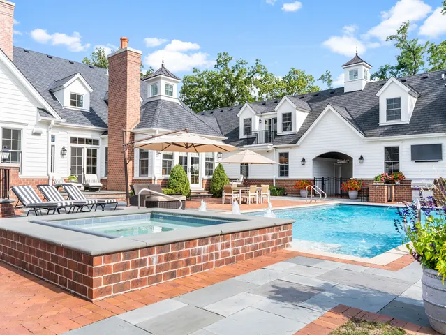 an aerial view of a house with garden space and street view