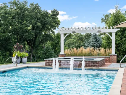 a living room filled with furniture and a potted plant