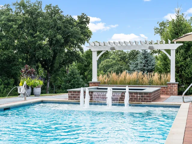 a living room filled with furniture and a potted plant