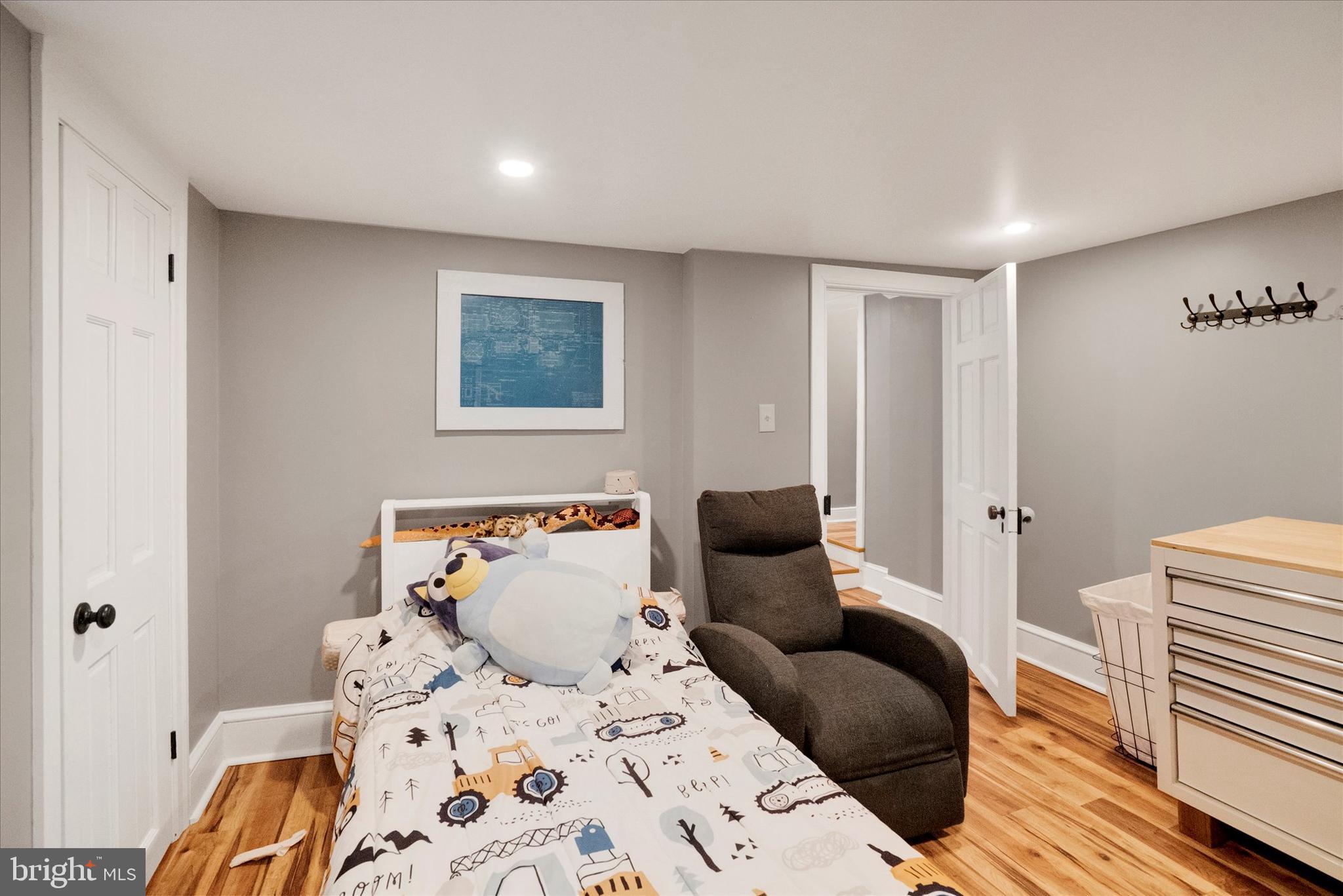 53 Main Street Oley, PA 19547 - Photo 22 of 26 a bedroom with a bed and wooden floor