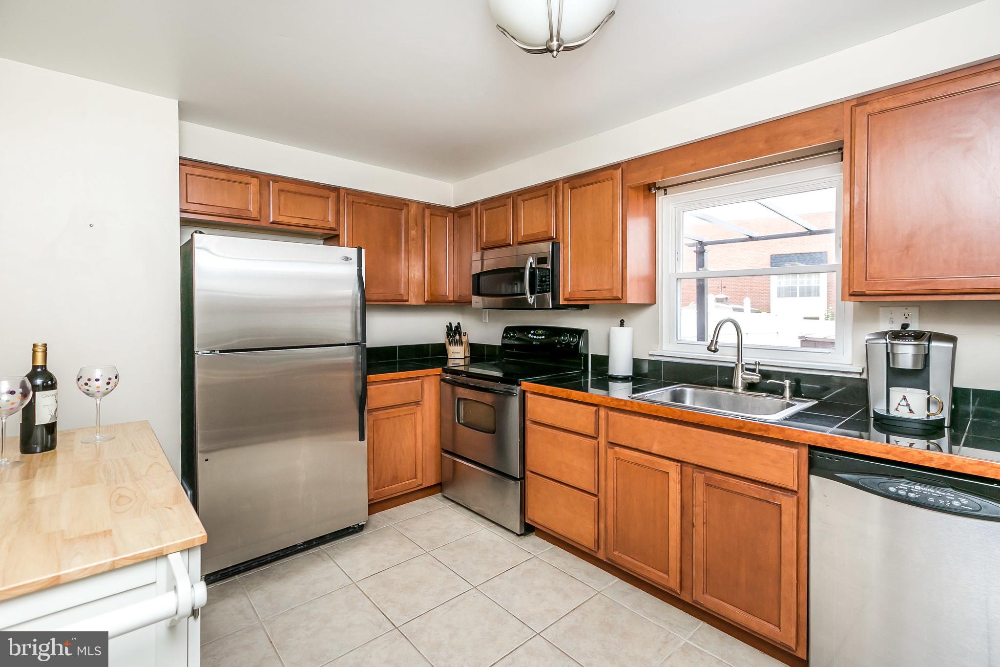 5652 Chelwynd Road Halethorpe, MD 21227 - Photo 8 of 35 Updated kitchen with stainless steel appliances