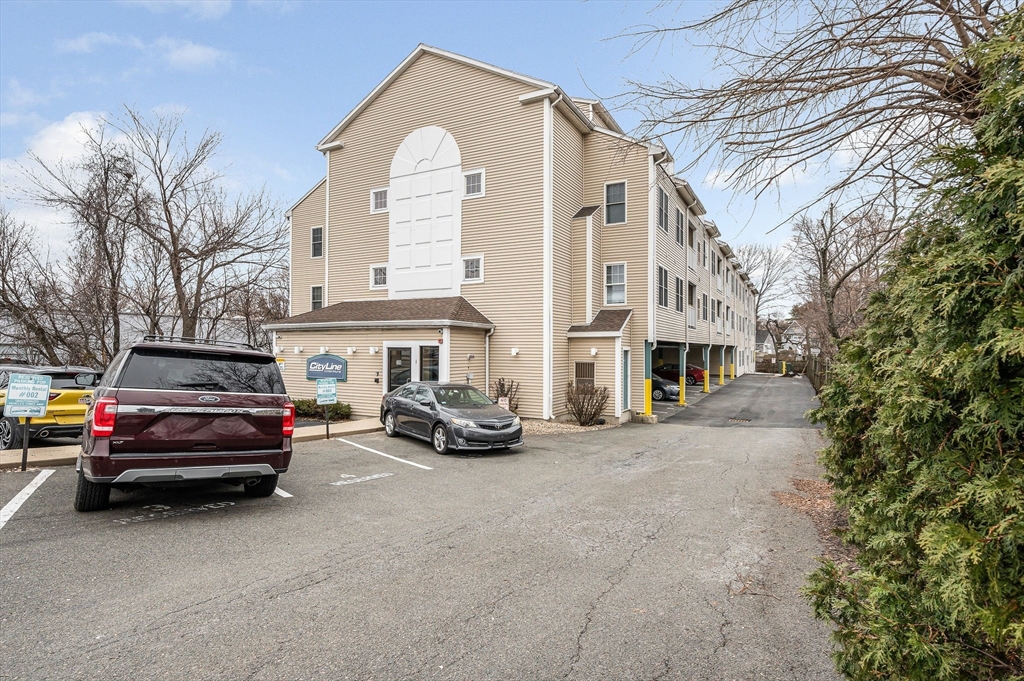 39 Broadway, Unit 305 Malden, MA 02148 - Photo 2 of 36 a view of multiple houses with a street