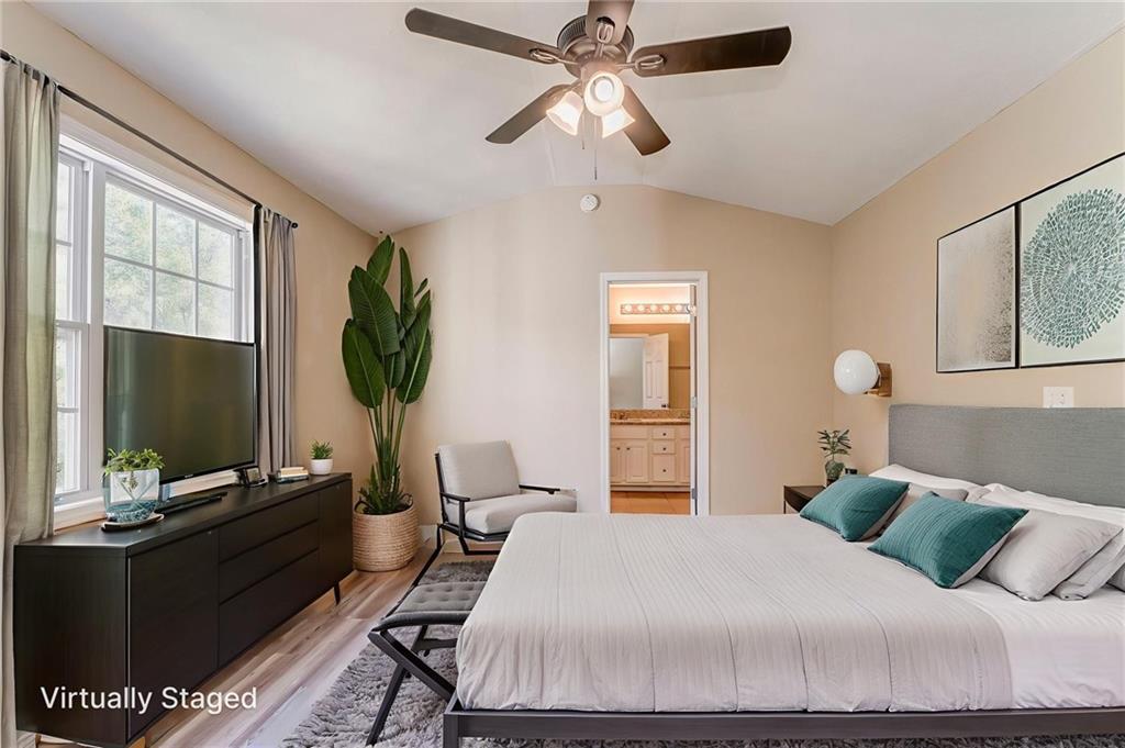 209 Enterprise Path Hiram, GA 30141 - Photo 14 of 31 a bedroom with a bed and a flat screen tv