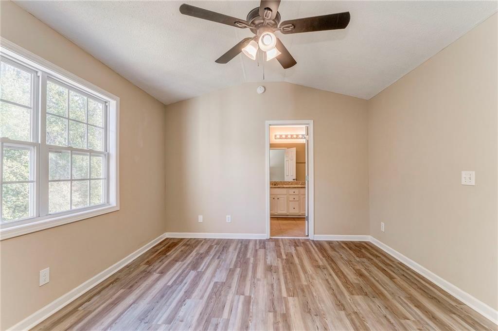 209 Enterprise Path Hiram, GA 30141 - Photo 15 of 31 a view of empty room with wooden floor and fan
