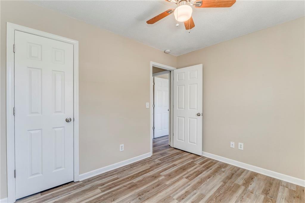 209 Enterprise Path Hiram, GA 30141 - Photo 16 of 31 a view of an empty room with wooden floor