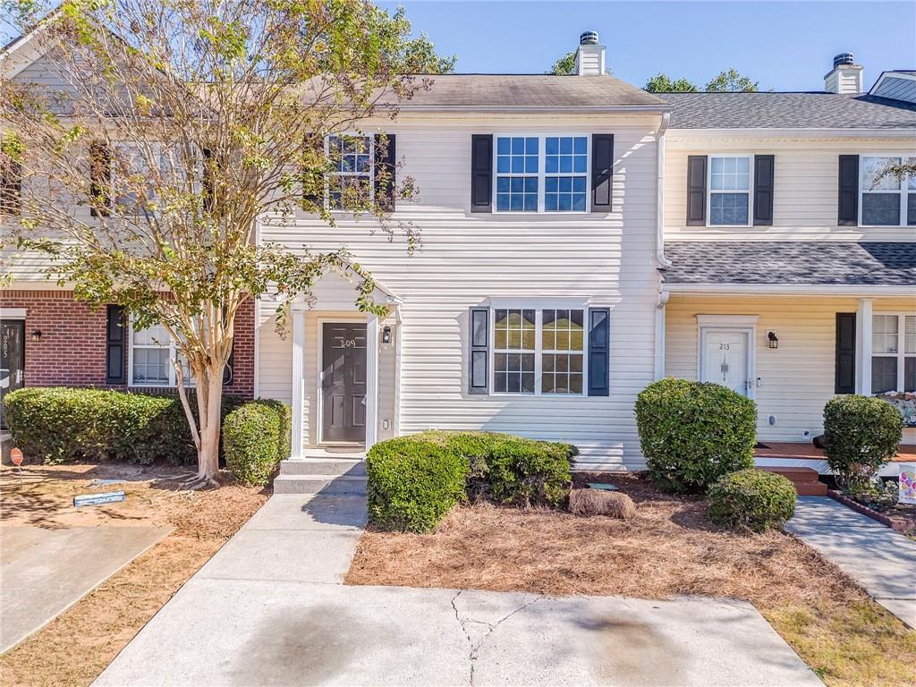 209 Enterprise Path Hiram, GA 30141 - Photo 2 of 31 a front view of a house with garden