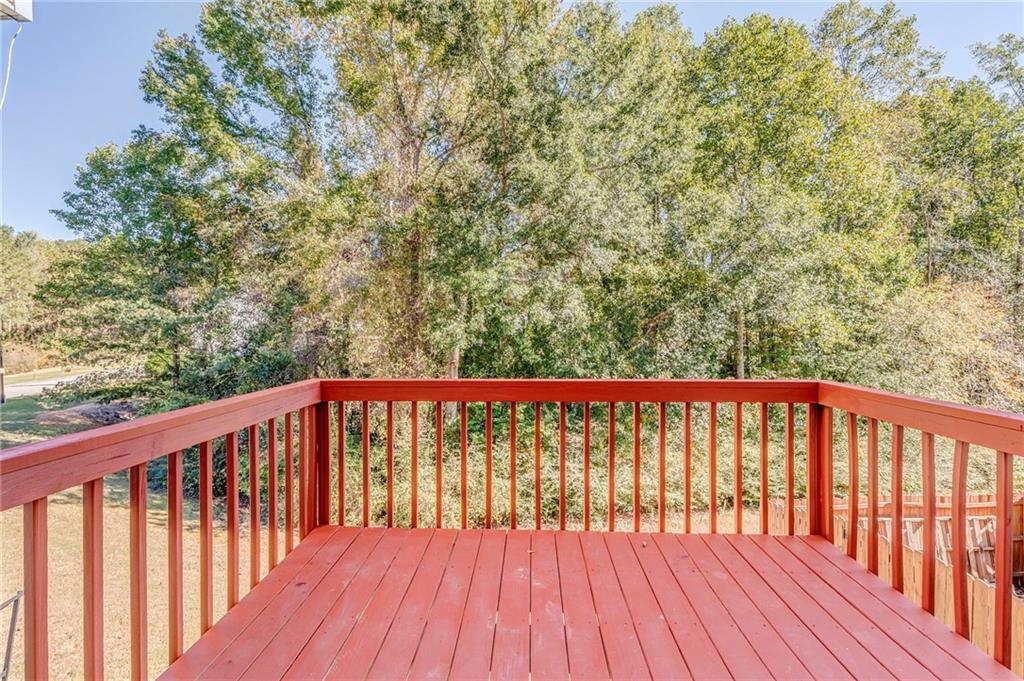 209 Enterprise Path Hiram, GA 30141 - Photo 29 of 31 a balcony with wooden floor and trees