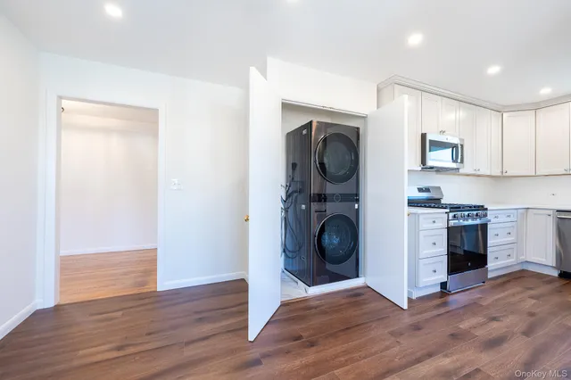 a view of a kitchen with washer and dryer