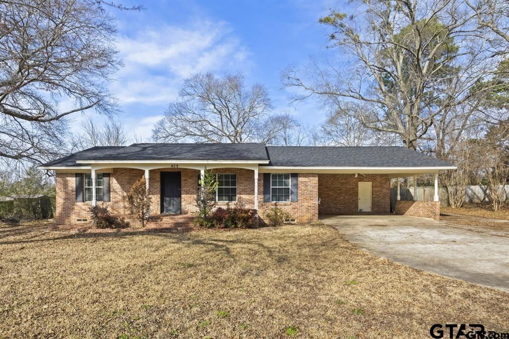front view of a house with a yard