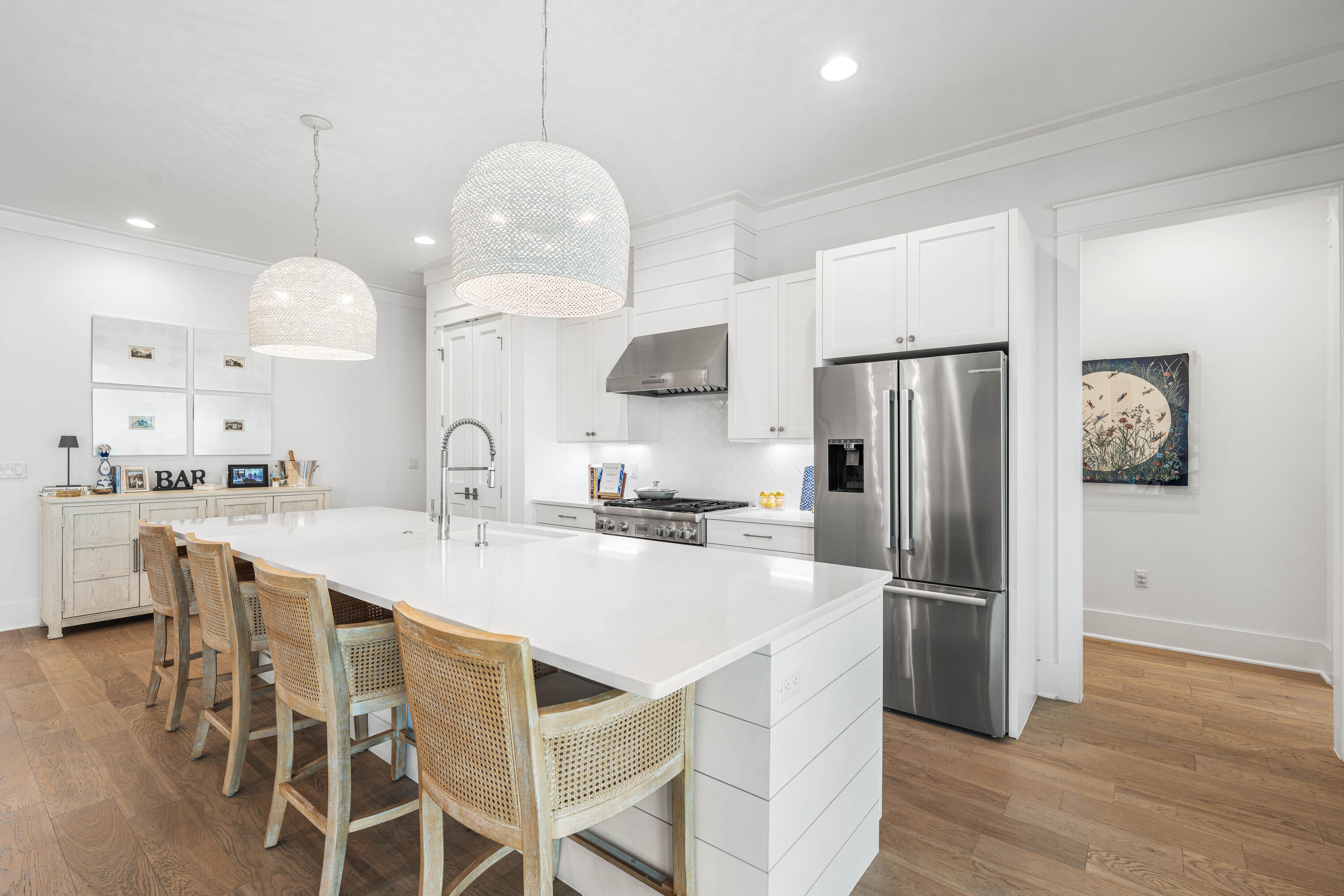 1016 Pathways Dr Inlet Beach Inlet Beach, FL 32461 - Photo 23 of 40 a kitchen with kitchen island wooden floor cabinets and appliances