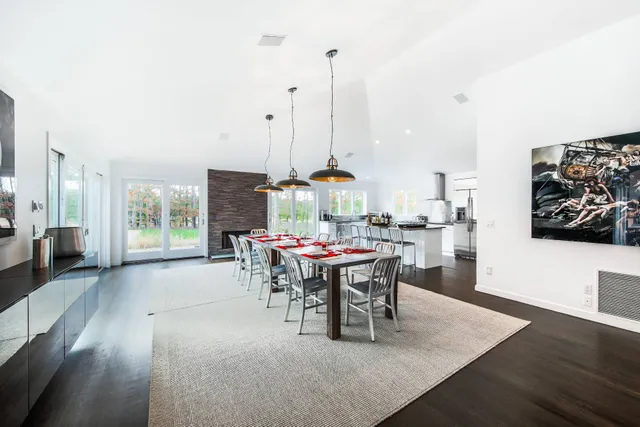 a dining room with furniture window and wooden floor