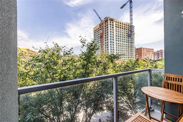 a view of a balcony with chair and table