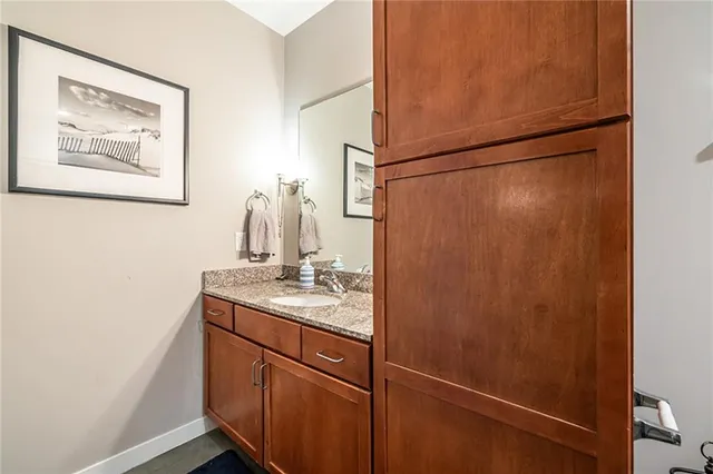 a bathroom with a shower and a sink