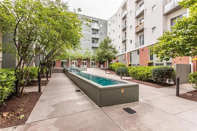 a view of a patio with couches and potted plants