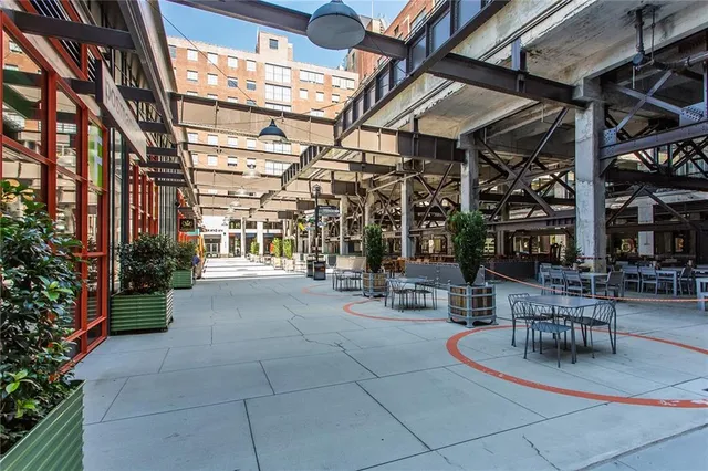 a building outdoor space with patio furniture and potted plants