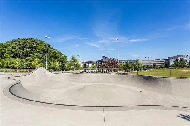 a view of a swimming pool and a yard