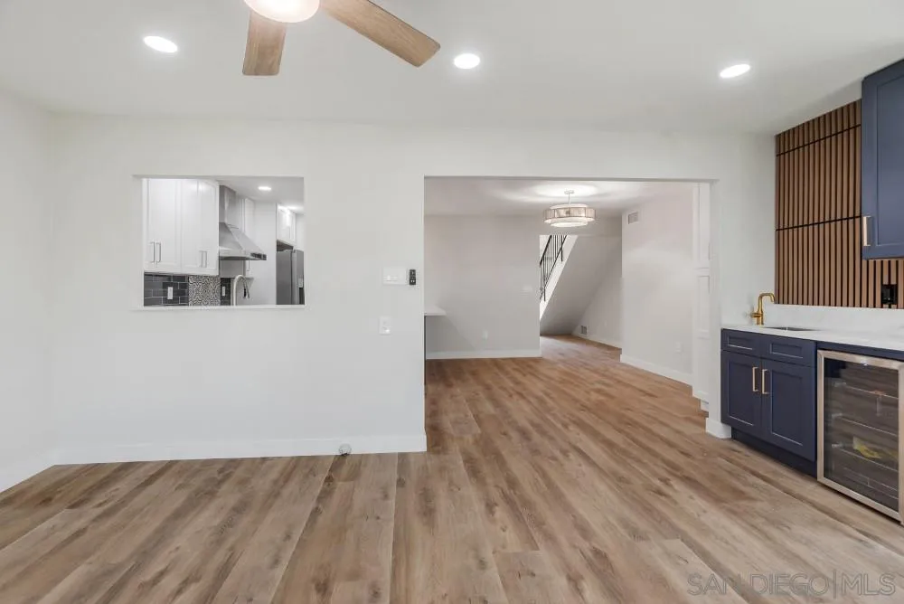 13765 Celestial Road Poway, CA 92064 - Photo 20 of 59 wooden floor in an empty room with a kitchen