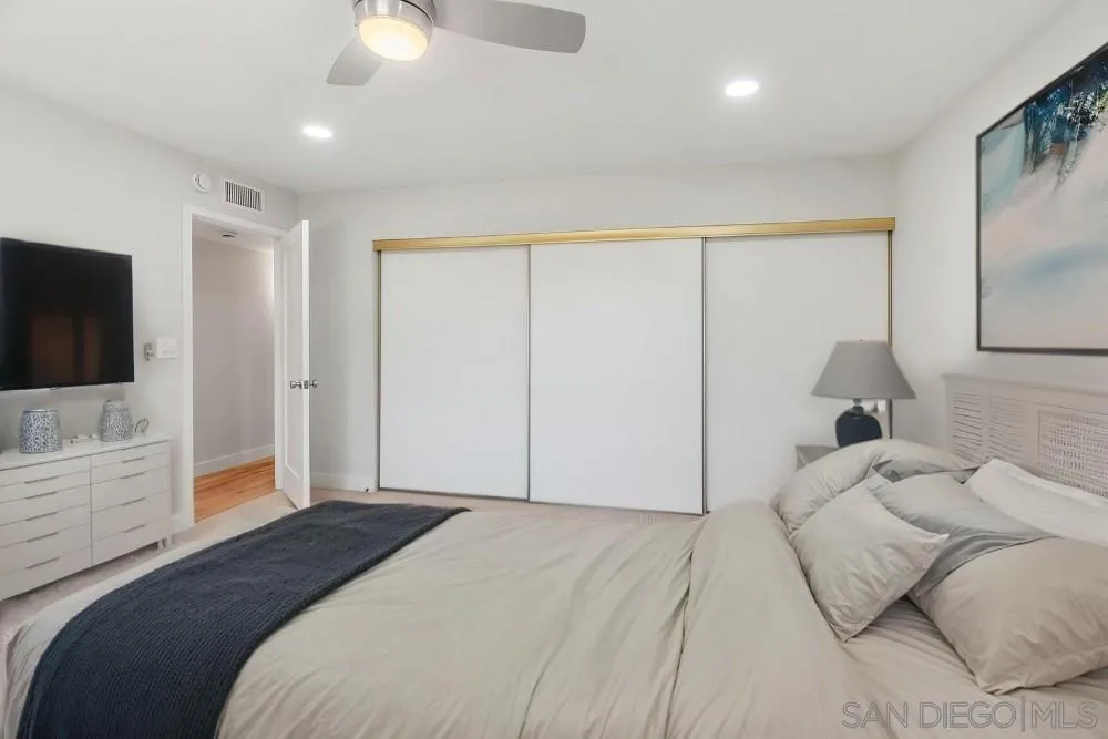 13765 Celestial Road Poway, CA 92064 - Photo 22 of 59 a bedroom with a large bed and a flat screen tv