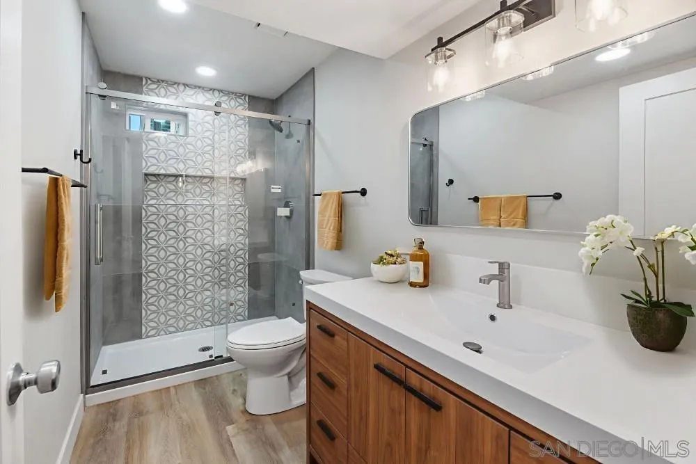 13765 Celestial Road Poway, CA 92064 - Photo 24 of 59 a bathroom with a sink toilet and shower