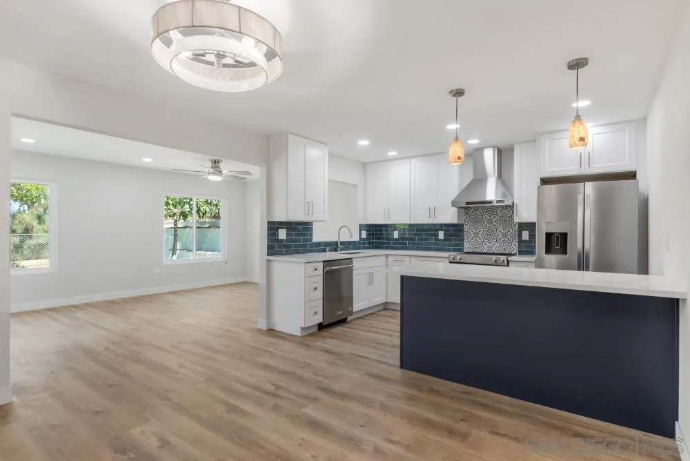 13765 Celestial Road Poway, CA 92064 - Photo 3 of 59 a kitchen with a refrigerator and a sink