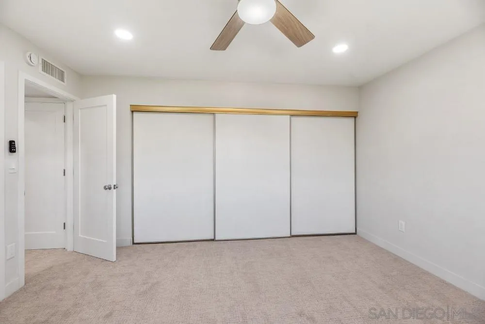 13765 Celestial Road Poway, CA 92064 - Photo 32 of 59 an empty room with a empty space and windows