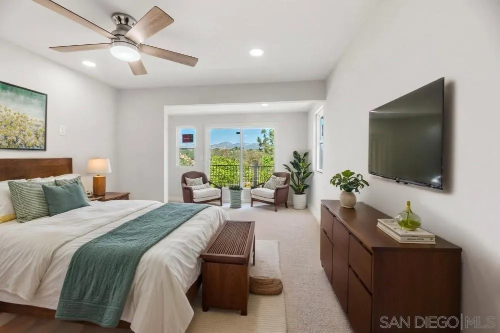 13765 Celestial Road Poway, CA 92064 - Photo 34 of 59 a bedroom with a bed and a flat screen tv