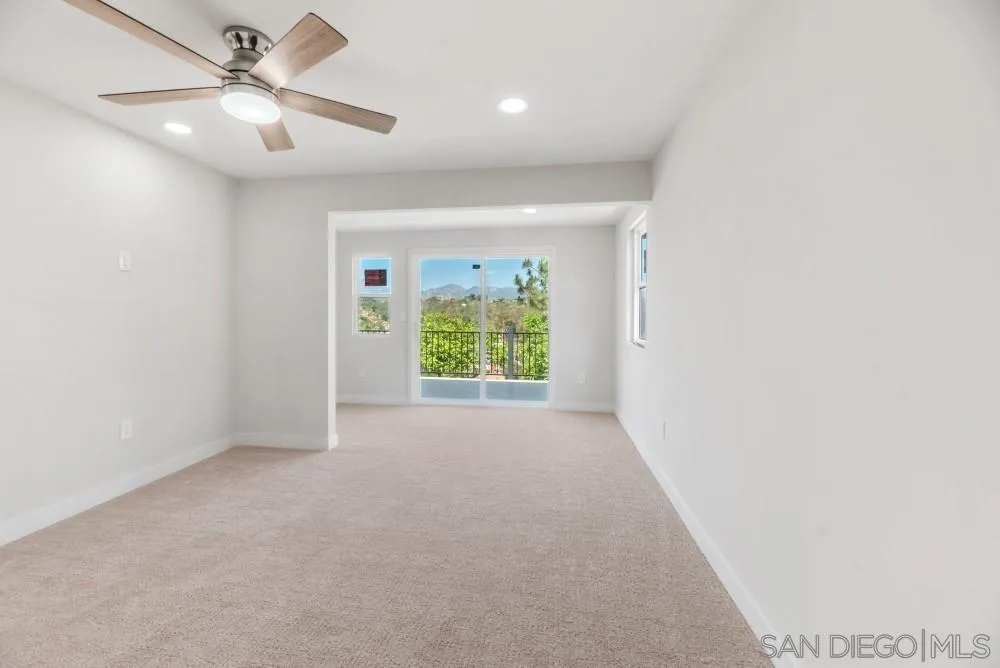 13765 Celestial Road Poway, CA 92064 - Photo 35 of 59 a view of a livingroom with a ceiling fan and window