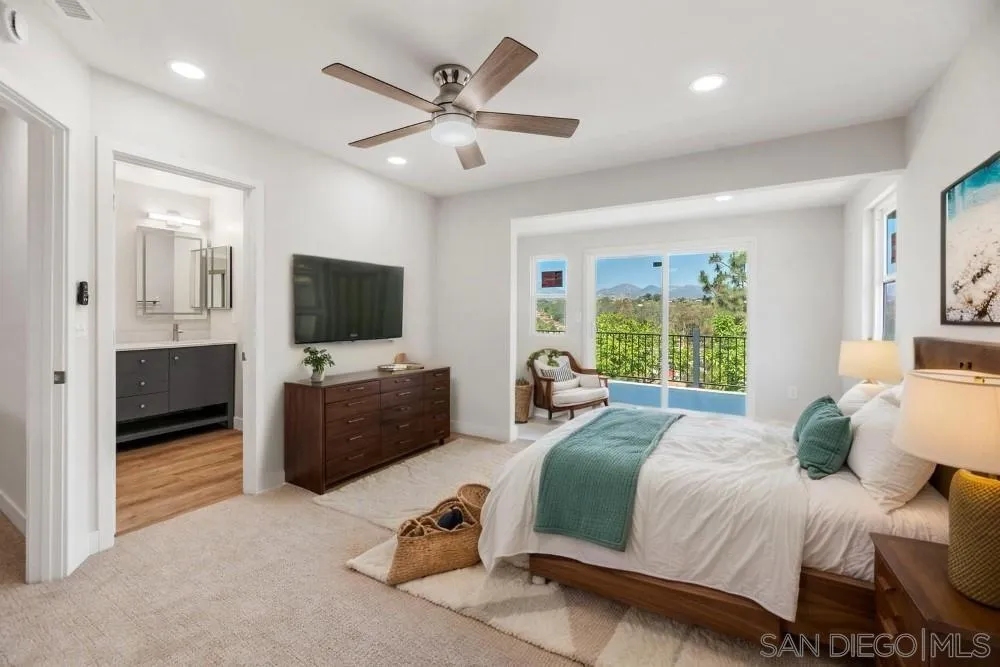 13765 Celestial Road Poway, CA 92064 - Photo 36 of 59 a bedroom with a bed and a flat screen television