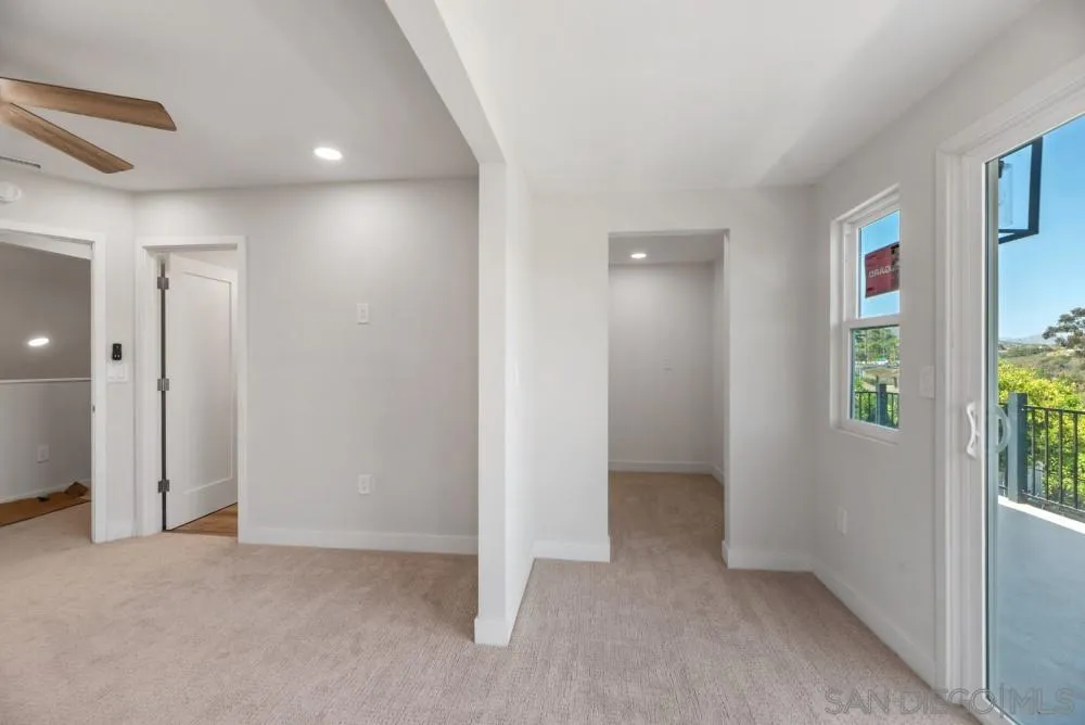 13765 Celestial Road Poway, CA 92064 - Photo 38 of 59 an empty room with windows and closet