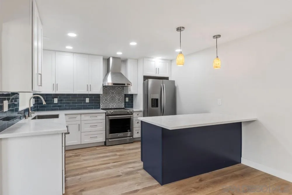 13765 Celestial Road Poway, CA 92064 - Photo 5 of 59 a kitchen with a sink refrigerator and microwave