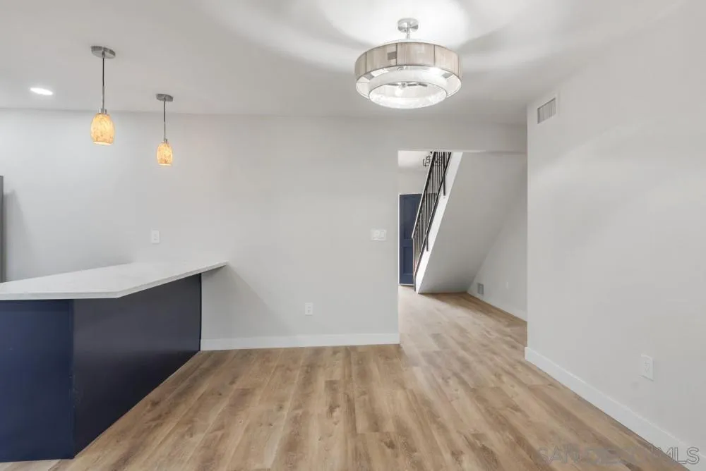 13765 Celestial Road Poway, CA 92064 - Photo 7 of 59 a view of an empty room with wooden floor