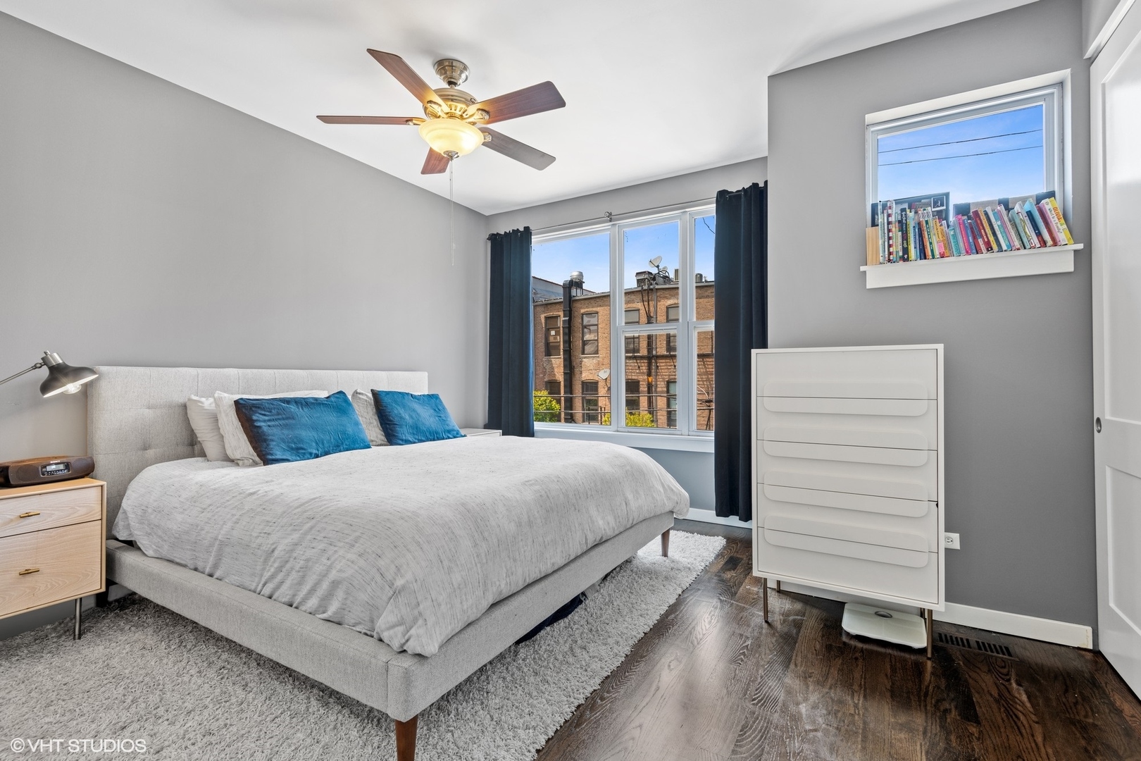 18 South Aberdeen Street, Unit 2 Chicago, IL 60607 - Photo 13 of 26 a bedroom with a large bed and a chandelier