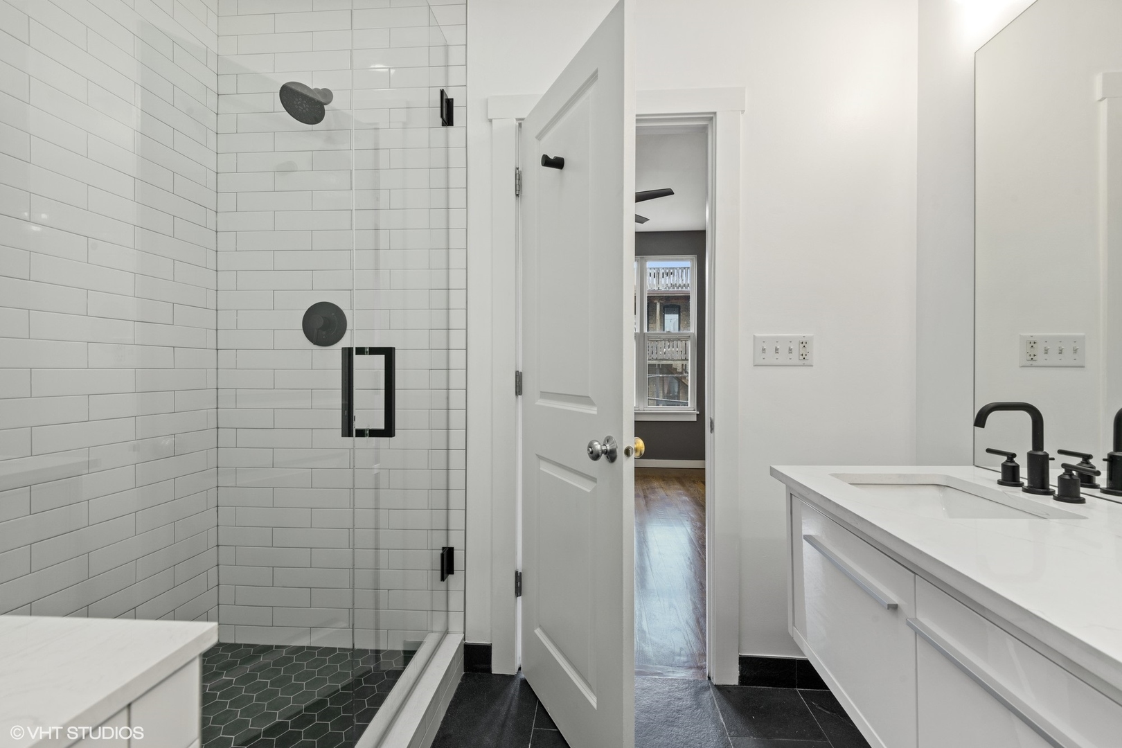 18 South Aberdeen Street, Unit 2 Chicago, IL 60607 - Photo 14 of 26 a bathroom with a sink shower and a mirror