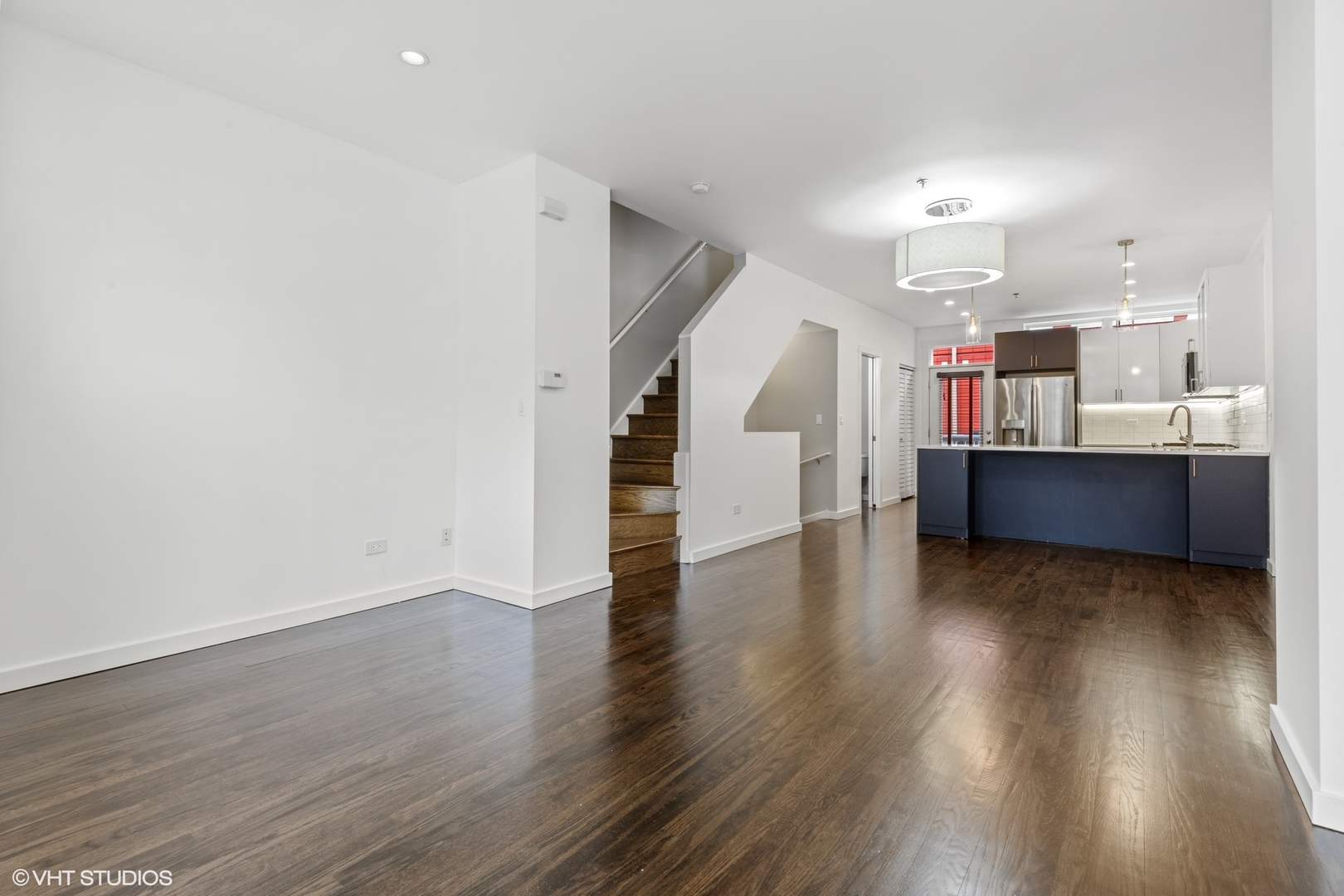 18 South Aberdeen Street, Unit 2 Chicago, IL 60607 - Photo 10 of 26 a view of a kitchen with wooden floor and cabinets