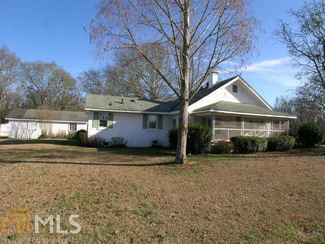 1627 Ed Bennett Road Nicholson, GA 30565 - Photo 1 of 1 a front view of a house with a yard