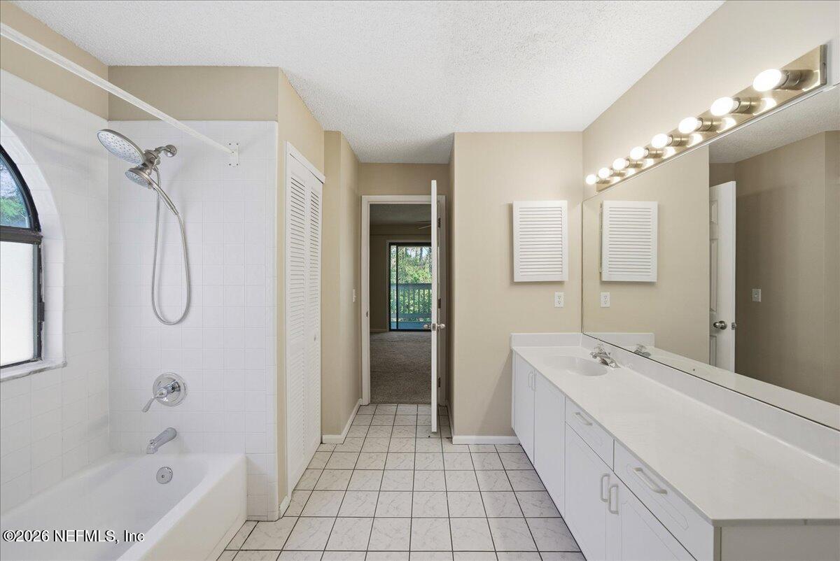 13075 Seedling Way Jacksonville, FL 32246 - Photo 15 of 48 a spacious bathroom with a tub sink and mirror