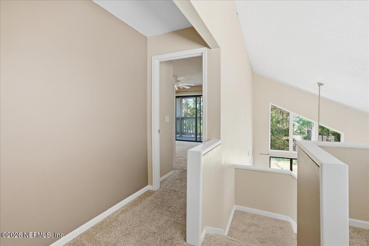 13075 Seedling Way Jacksonville, FL 32246 - Photo 18 of 48 a view of a room that has a window in it