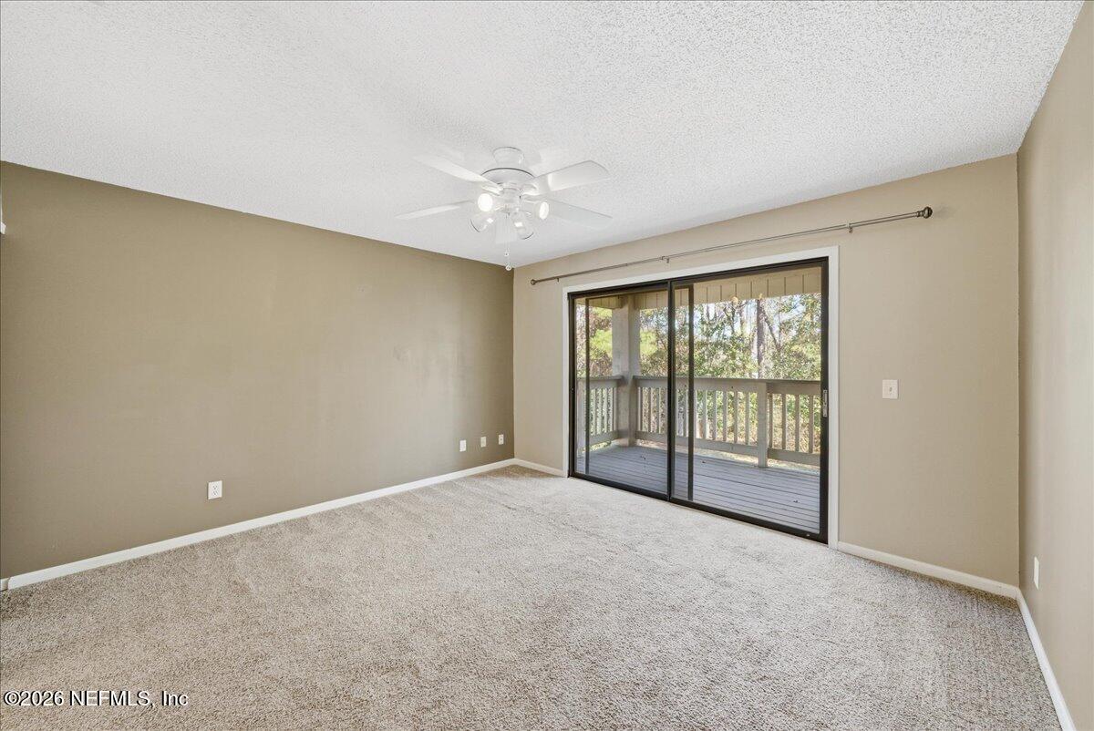 13075 Seedling Way Jacksonville, FL 32246 - Photo 19 of 48 a view of an empty room with a window